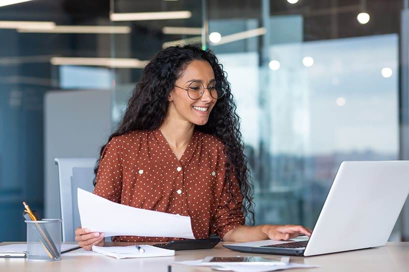 Young female professional works on her laptop in an office space copy.jpg