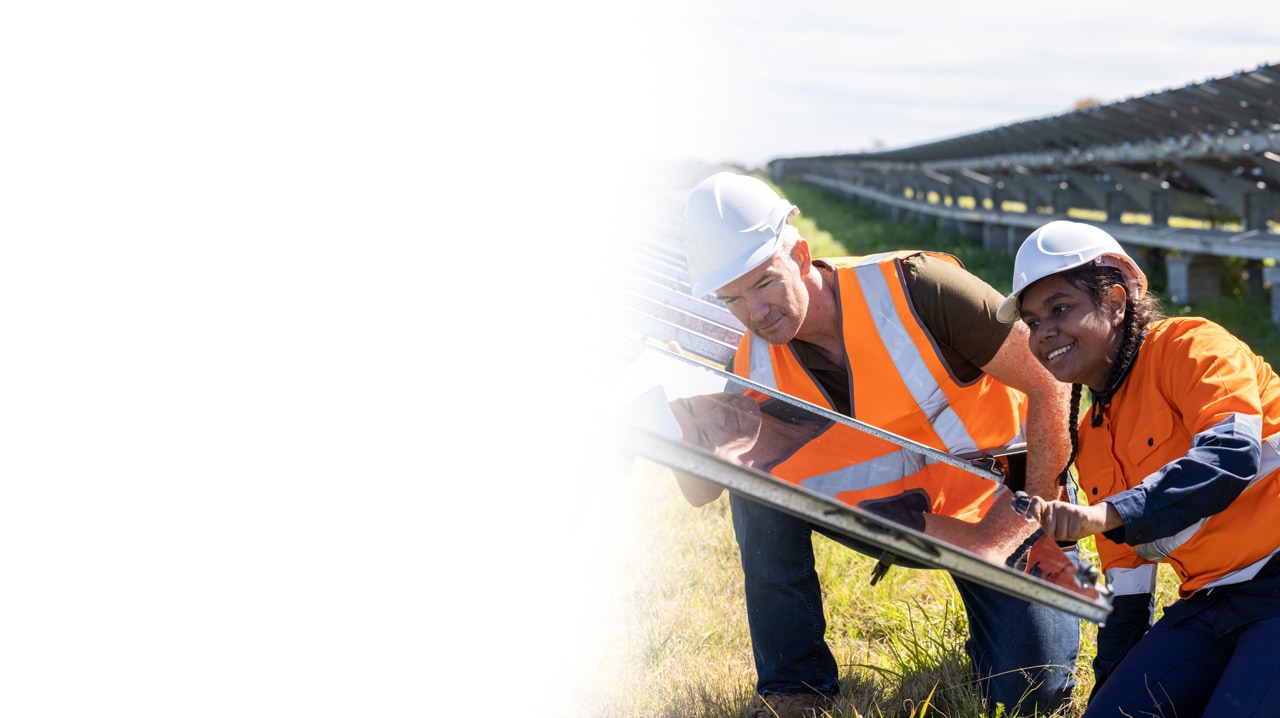 Trainee and supervisor with solar panels