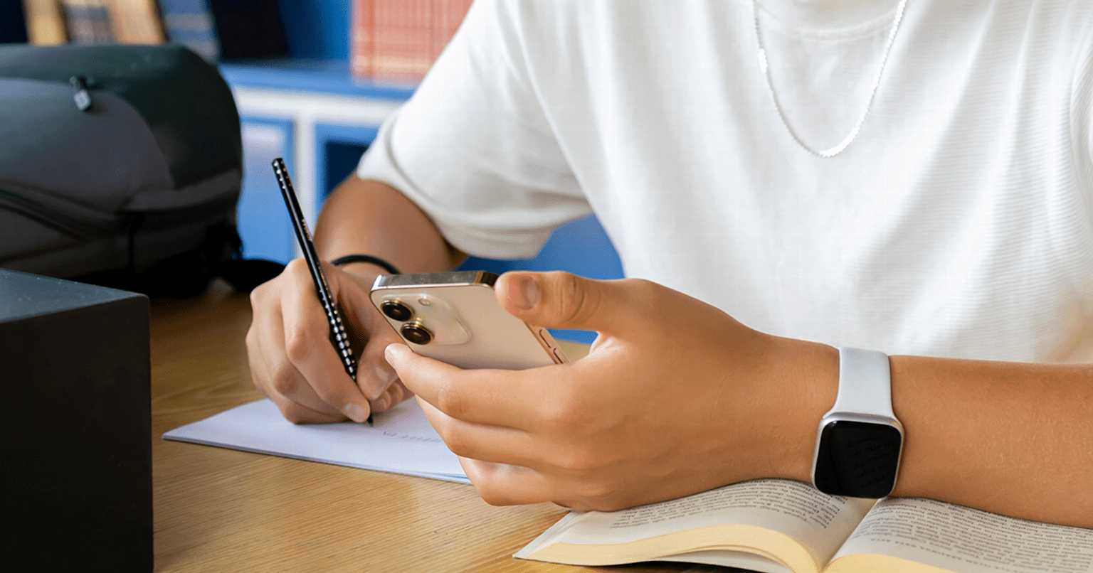 Student holding a mobile phone
